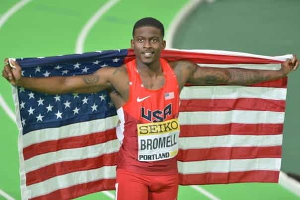 Trayvon Bromell proudly holds an American flag after winning the 2016 IAAF World Indoor Championships in Portland.