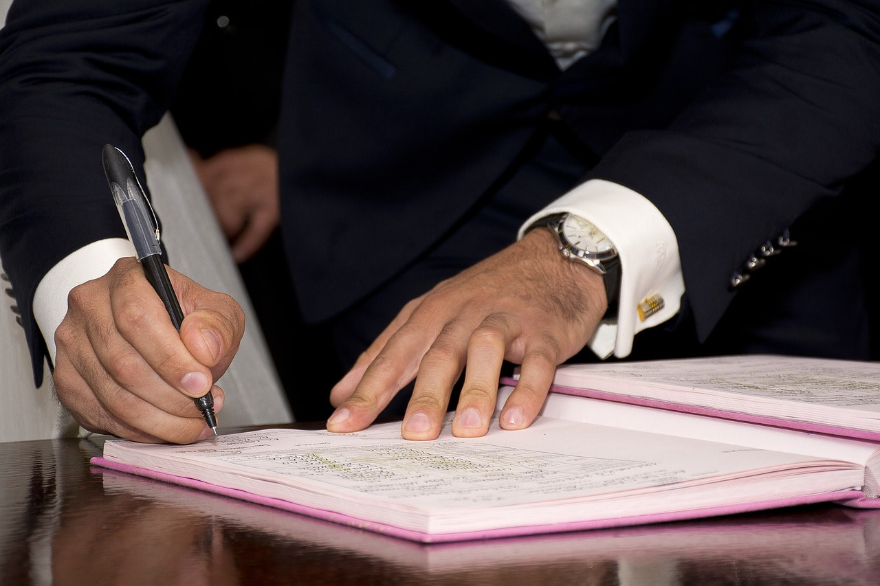 Signing a deal.